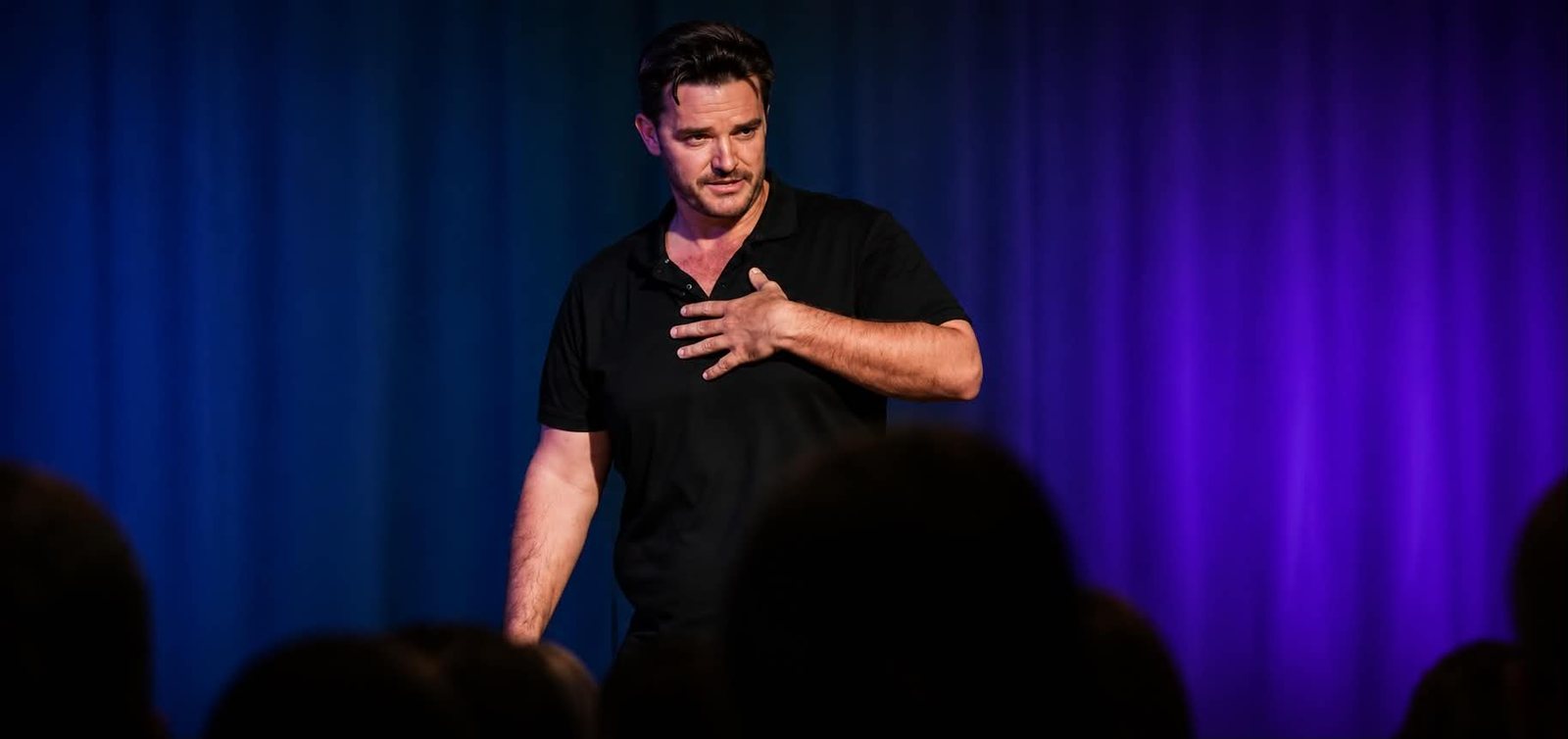 Mark Barnes speaking on stage